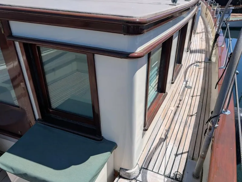 Slide: The Image of Classic 1936 Motorsailer with wooden deck and cabin windows, showcasing vintage nautical design. - 10