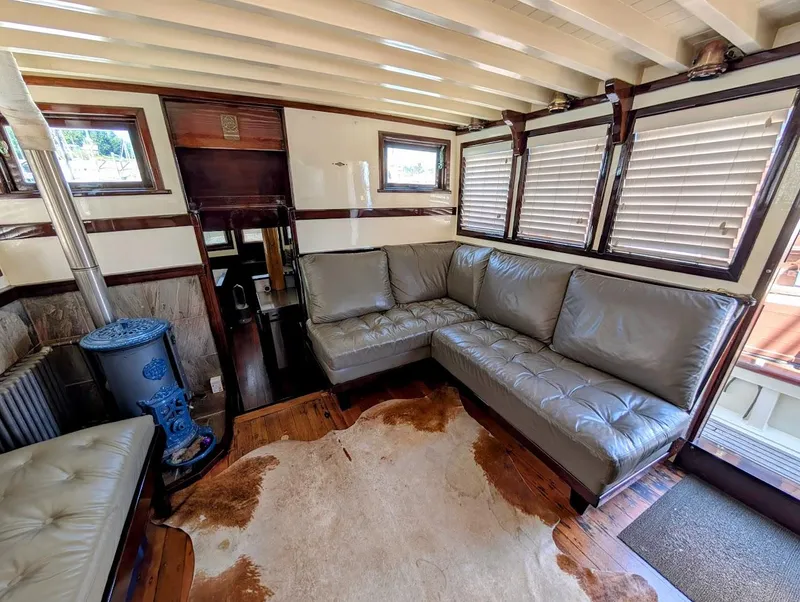 Slide: The Image of Interior of a 1936 Classic Motorsailer with leather seating and vintage decor. - 18