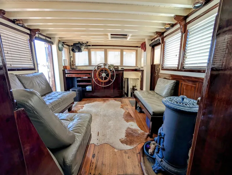 Slide: The Image of Interior of a 1936 Classic Motorsailer with vintage decor and wooden furnishings. - 21