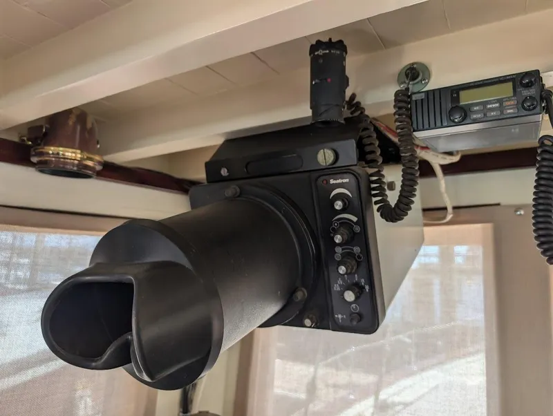 Slide: The Image of 1936 Classic Motorsailer interior with vintage marine radio and speaker system. - 23