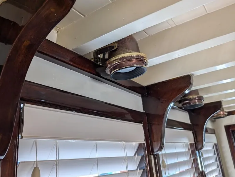 Slide: The Image of Interior of 1936 Classic Motorsailer with vintage wooden beams and nautical decor. - 25