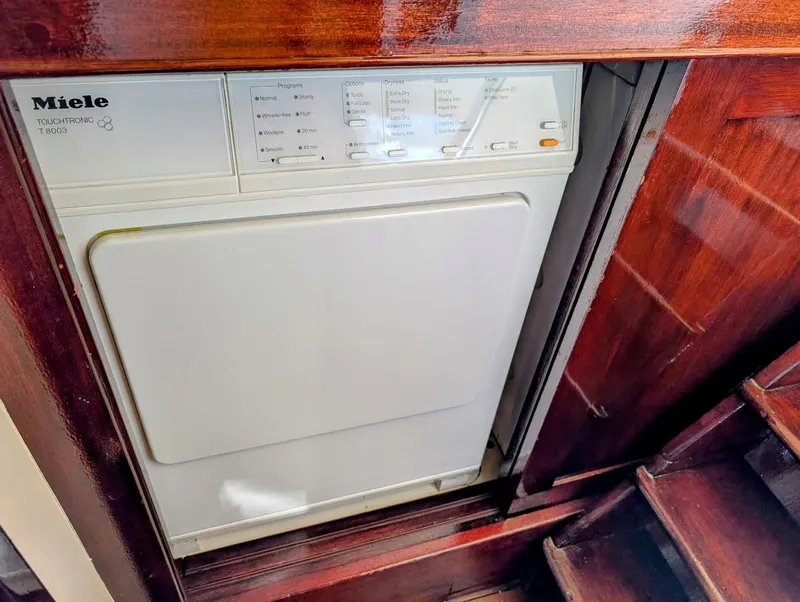 Slide: The Image of Miele dryer installed in a 1936 Classic Motorsailer with wooden interior. - 48