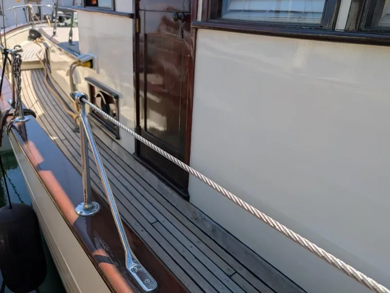 Slide: The Image of Classic 1936 Motorsailer with wooden deck and polished railings, showcasing vintage nautical craftsmanship. - 7