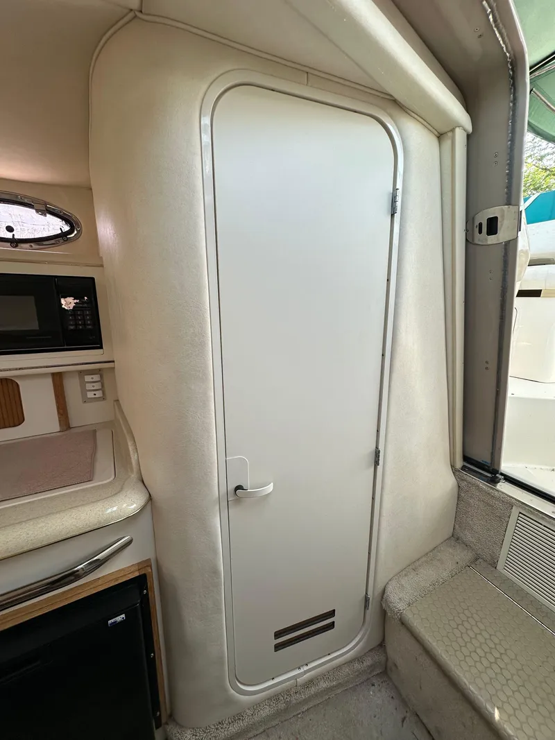 Slide: The Image of Interior cabin door of 1998 Sea Ray 290 Sundancer boat. - 21