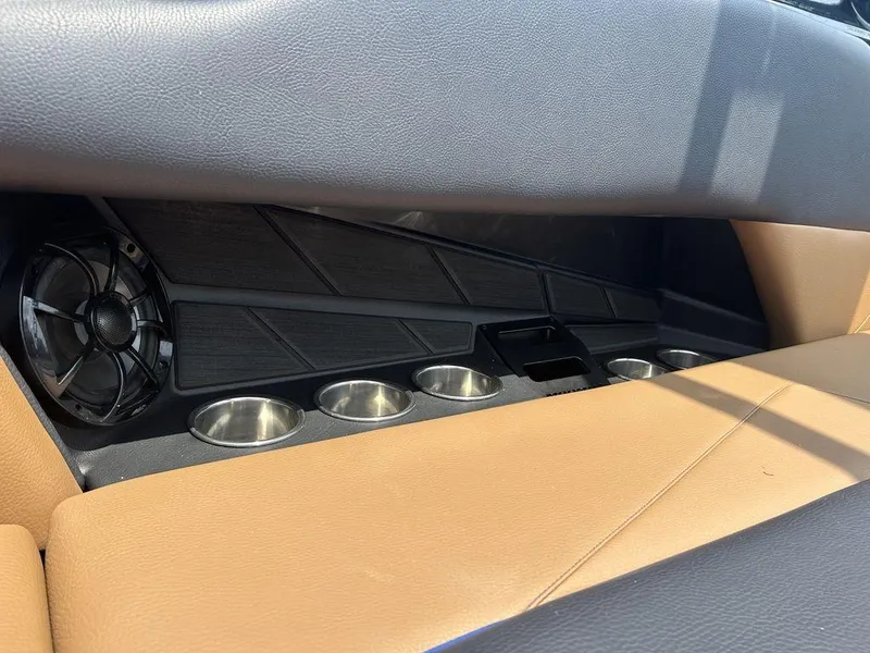 Slide: The Image of 2025 Moomba Tykon interior with cup holders and speaker detail. - 28