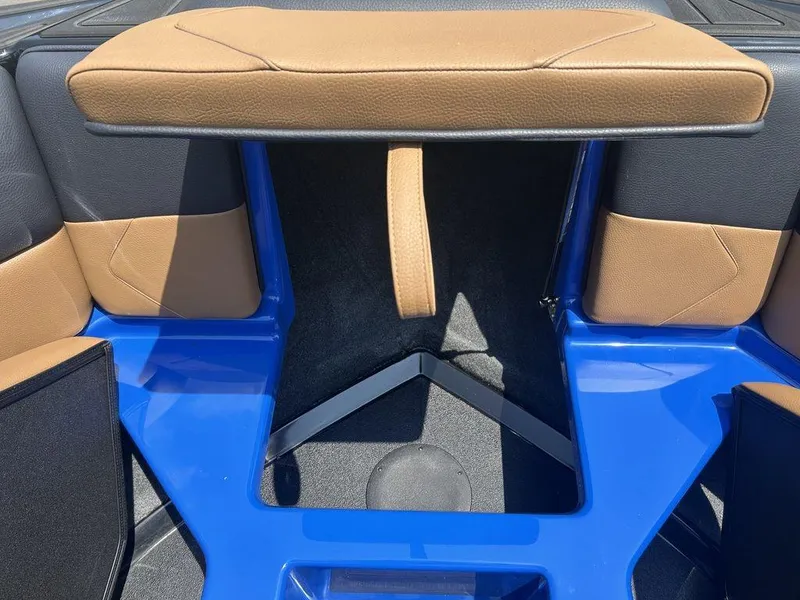 Slide: The Image of 2025 Moomba Tykon boat interior with blue and tan seating. - 4