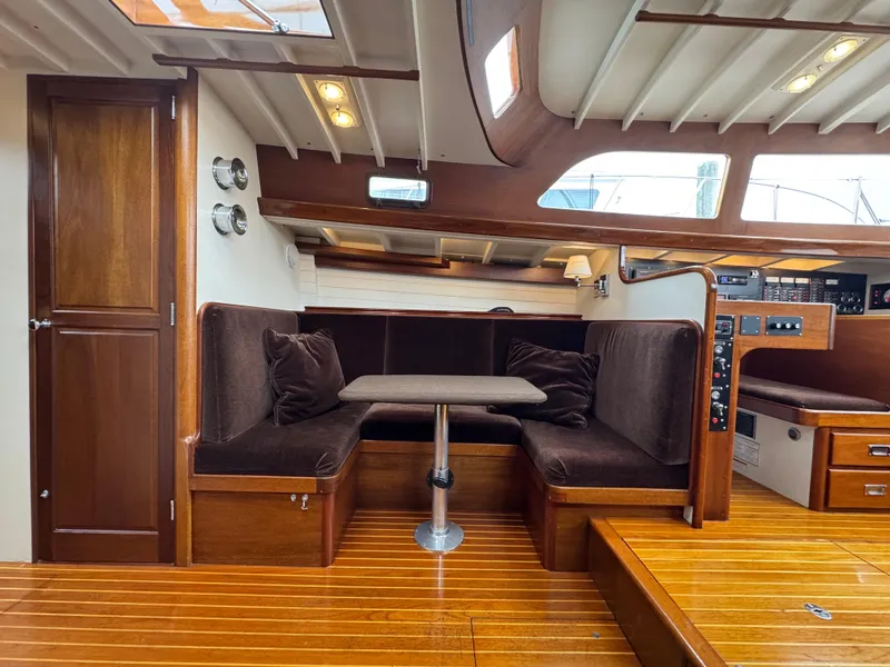 Slide: The Image of Interior of 1970 Sparkman and Stephens yacht with wooden finish and cozy seating area. - 12