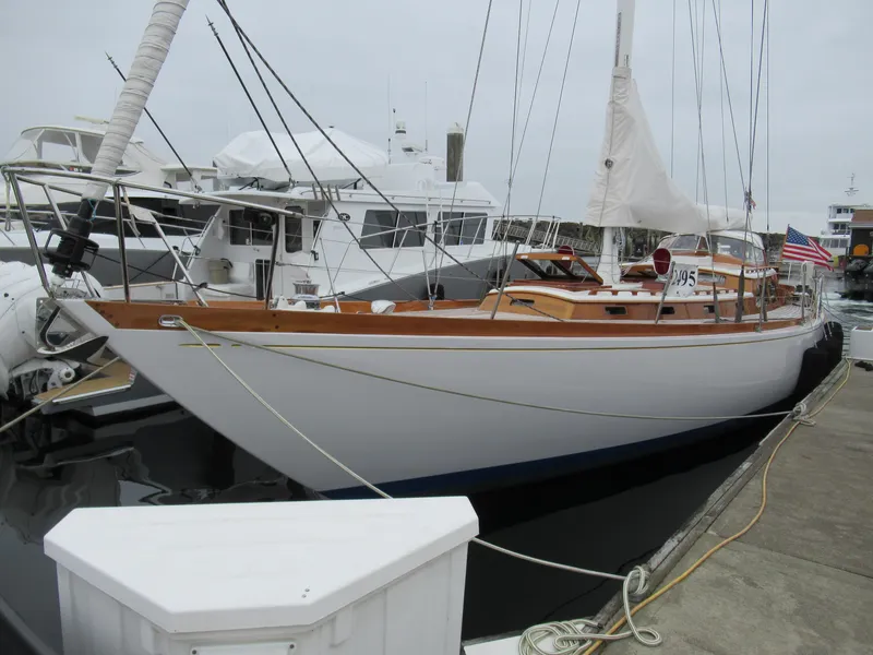 Slide: The Image of Vintage 1970 Sparkman and Stephens sailboat docked, showcasing classic design and wooden accents. - 25
