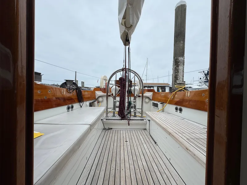 Slide: The Image of 1970 Custom Sparkman and Stephens sailboat deck with wooden accents and nautical equipment. - 27