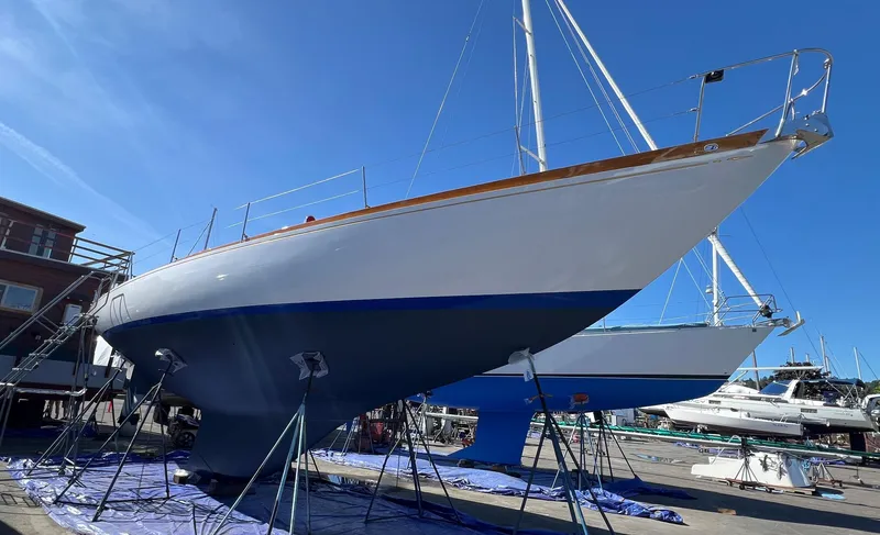 Slide: The Image of 1970 Custom Sparkman and Stephens yacht on dry dock under clear blue sky. - 32