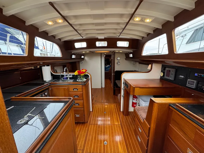 Slide: The Image of Luxurious 1970 Sparkman and Stephens yacht interior with polished wood and modern amenities. - 4
