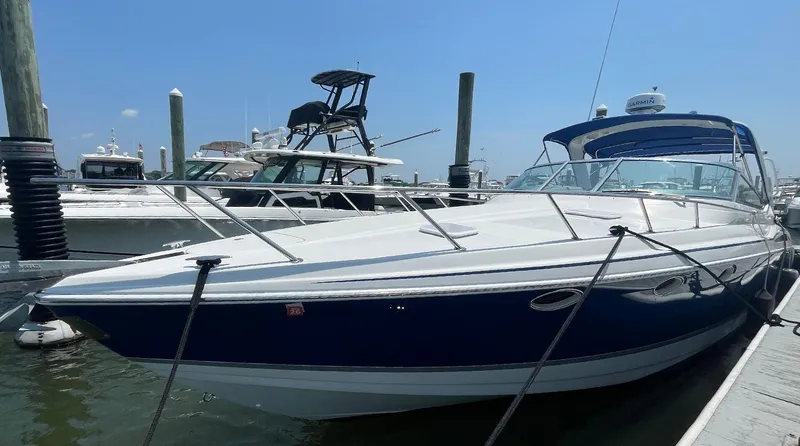 Slide: The Image of 2003 Formula 370 SS boat docked at marina under clear blue sky. - 3