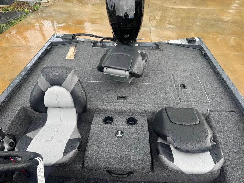 Slide: The Image of 2025 Crestliner XF 179 boat interior with gray seating and storage compartments. - 8