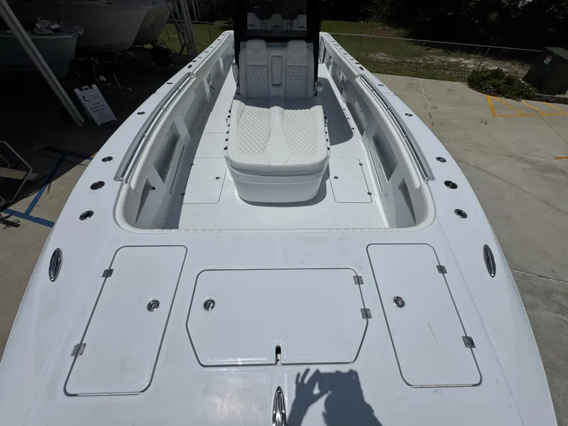 Slide: The Image of 2026 Invincible 36 Catamaran boat deck with seating and storage compartments. - 19