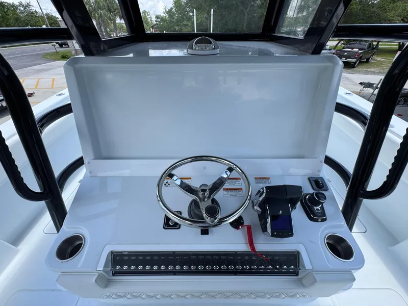 Slide: The Image of Helm of 2026 Invincible 36 Catamaran featuring steering wheel and controls. - 34
