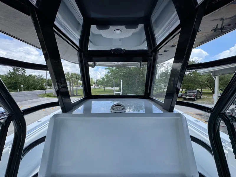 Slide: The Image of 2026 Invincible 36 Catamaran cockpit view with sleek design and clear canopy. - 35