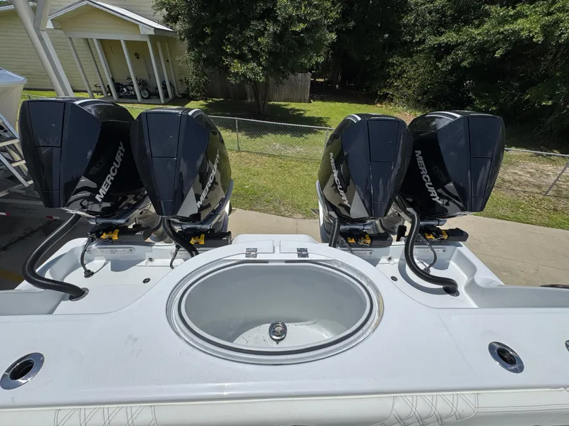 Slide: The Image of 2026 Invincible 36 Catamaran with four Mercury outboard engines and a central livewell. - 42