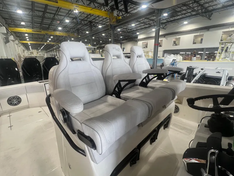 Slide: The Image of 2024 SeaVee 390Z boat interior with plush seating in a spacious, modern design. - 11