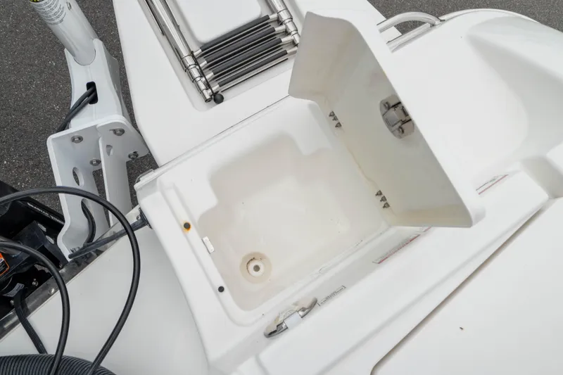 Slide: The Image of Open storage compartment on 2026 Crevalle 24 HCO boat, showcasing interior details. - 15