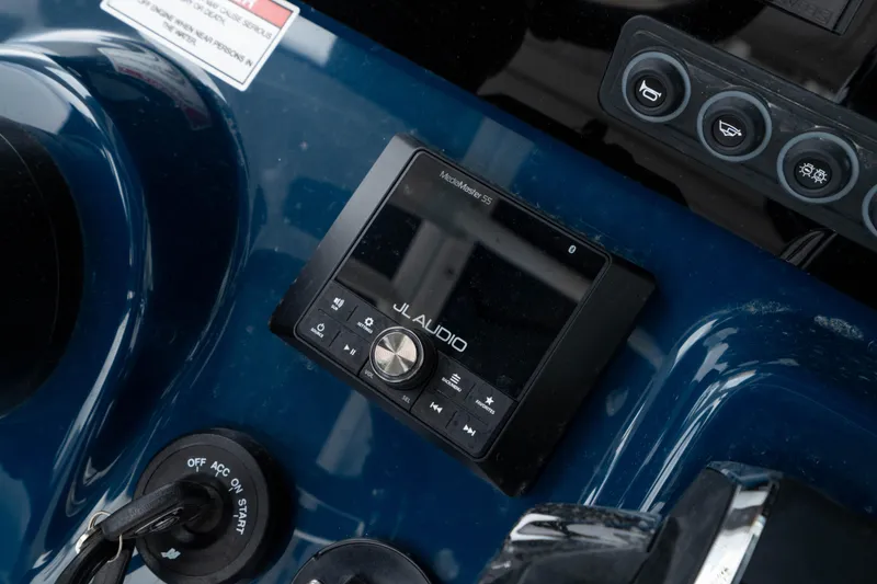 Slide: The Image of Control panel of 2026 Crevalle 24 HCO boat featuring JL Audio system. - 26
