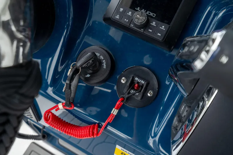 Slide: The Image of Control panel of 2026 Crevalle 24 HCO boat with ignition and audio system. - 27