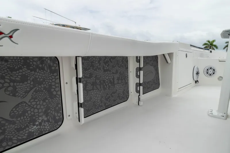 Slide: The Image of 2026 Crevalle 24 HCO boat interior with storage compartments and sleek design. - 33