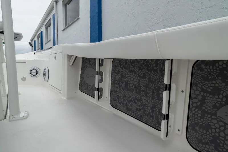 Slide: The Image of 2026 Crevalle 24 HCO boat interior with storage compartments and speakers. - 34
