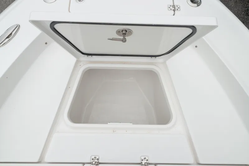 Slide: The Image of Open storage compartment on 2026 Crevalle 24 HCO boat, showcasing spacious interior. - 38