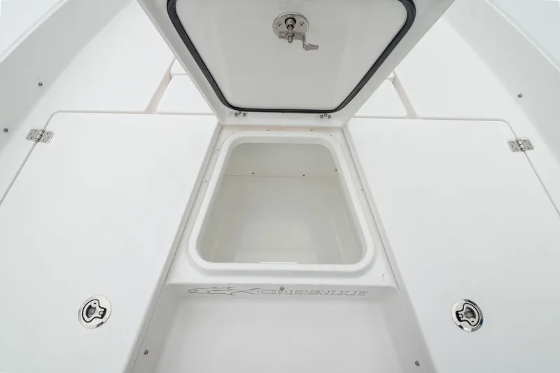 Slide: The Image of 2026 Crevalle 24 HCO boat storage compartment with open hatch, showcasing spacious interior. - 40