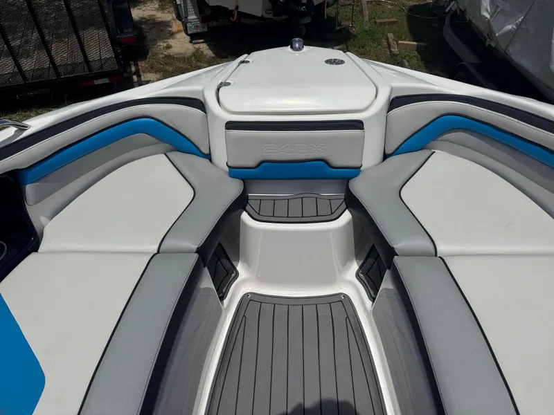 Slide: The Image of 2018 Yamaha Boats 242X E-Series interior with gray and blue seating. - 14