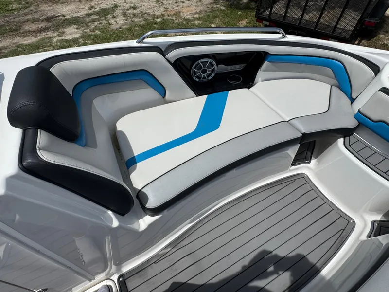 Slide: The Image of 2018 Yamaha Boats 242X E-Series interior with stylish seating and speaker system. - 15