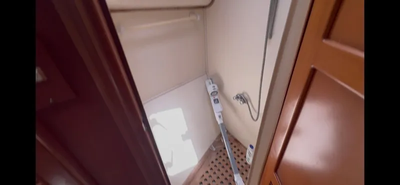 Slide: The Image of Shower area in 1988 Offshore Yachts 48 CPMY with wooden flooring and fixtures. - 25