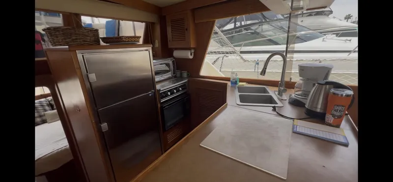 Slide: The Image of Interior of 1988 Offshore Yachts 48 CPMY kitchen with appliances and sink. - 3