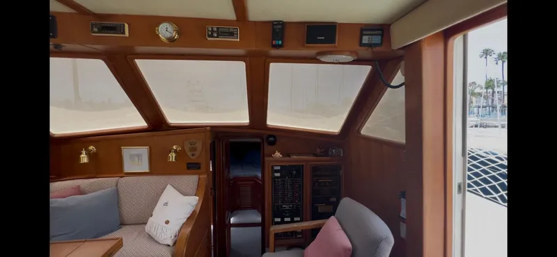Slide: The Image of Interior of 1988 Offshore Yachts 48 CPMY with seating and control panels. - 8