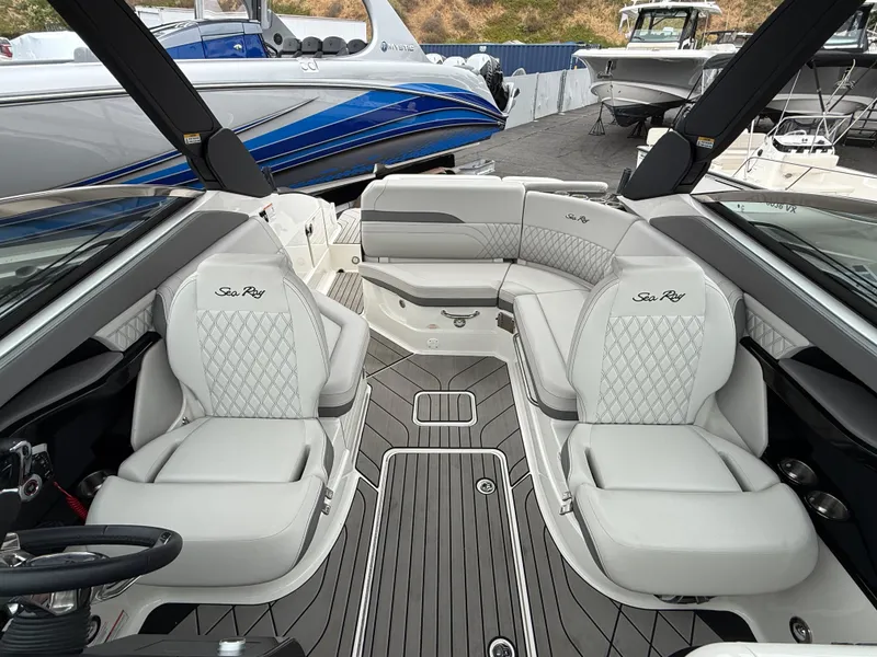 Slide: The Image of 2024 Sea Ray SLX 260 boat interior with luxurious seating and modern design. - 10