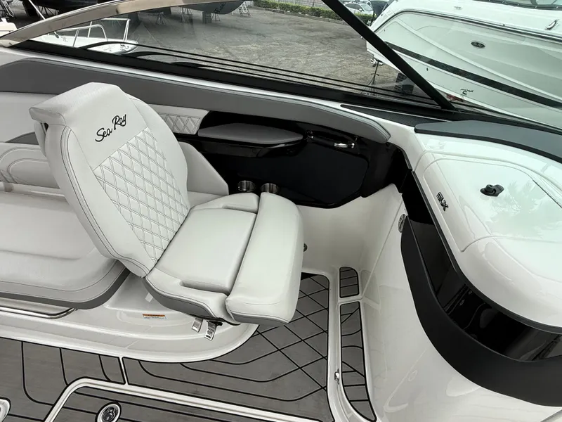 Slide: The Image of 2024 Sea Ray SLX 260 boat interior with luxurious seating and modern design. - 12