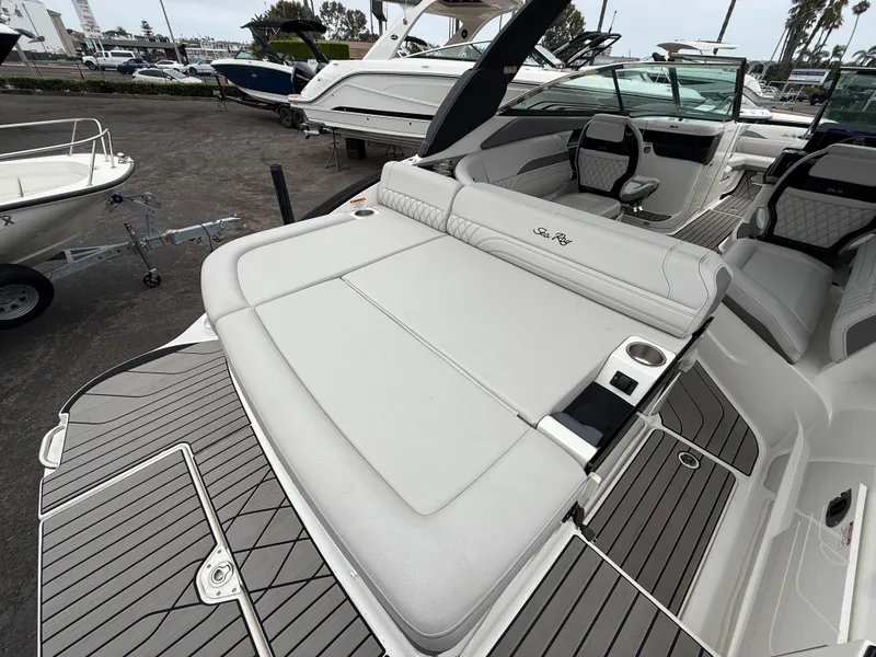 Slide: The Image of 2024 Sea Ray SLX 260 boat with spacious seating and sleek design. - 7