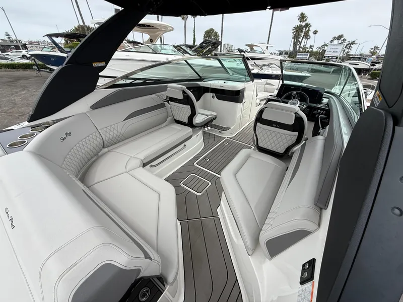Slide: The Image of 2024 Sea Ray SLX 260 boat interior with luxurious seating and modern design. - 8