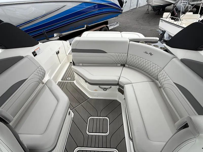 Slide: The Image of 2024 Sea Ray SLX 260 boat interior with luxurious seating and modern design. - 9