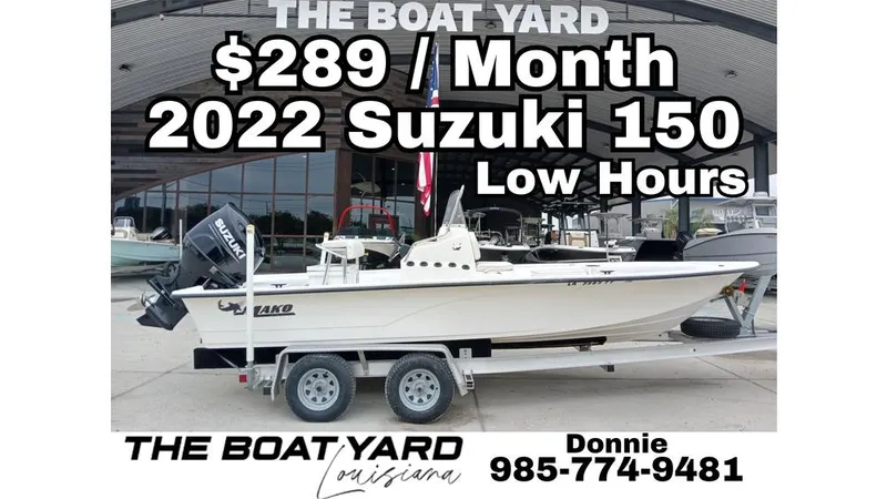 Slide: The Image of Boat dealership offering 2022 Suzuki 150 with low hours for $289/month. Contact Donnie at 985-774-9481. - 12
