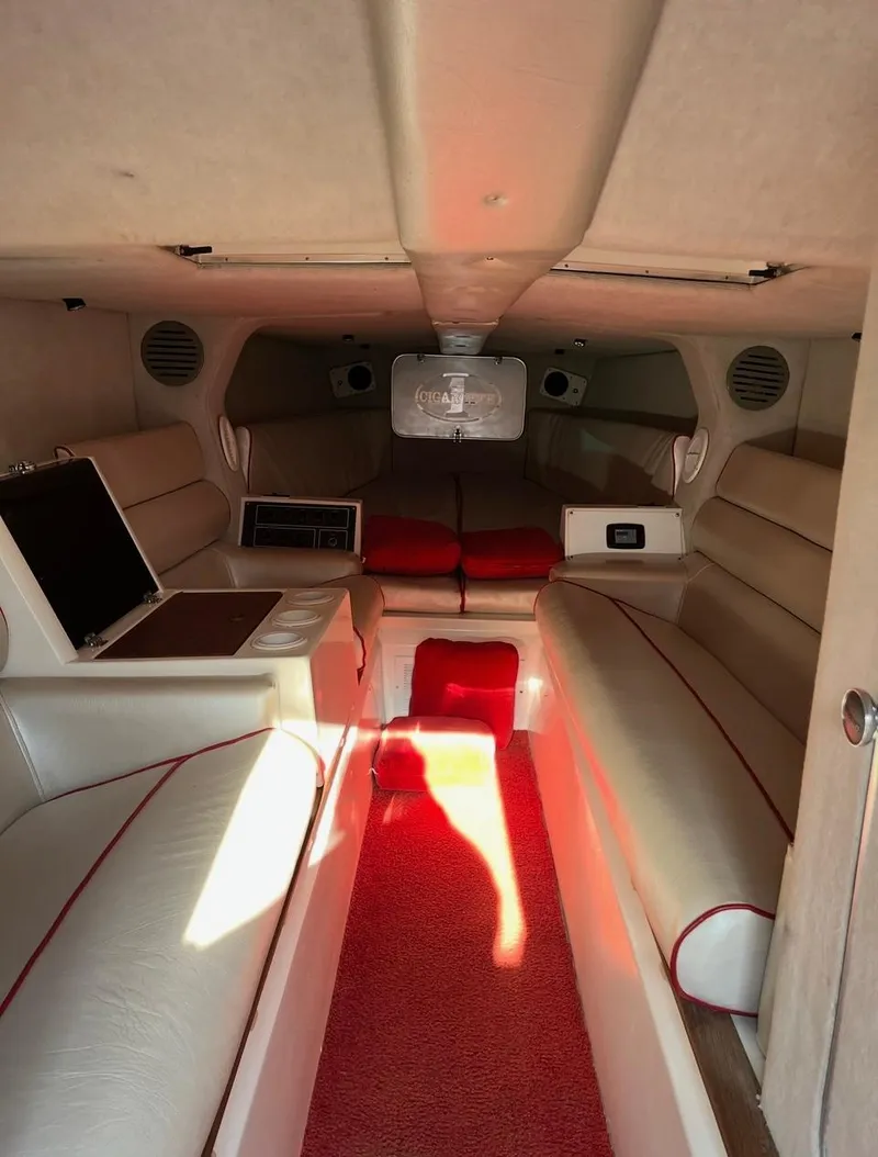 Slide: The Image of Interior of a 1987 Cigarette 38 Top Gun boat with red and white seating. - 3