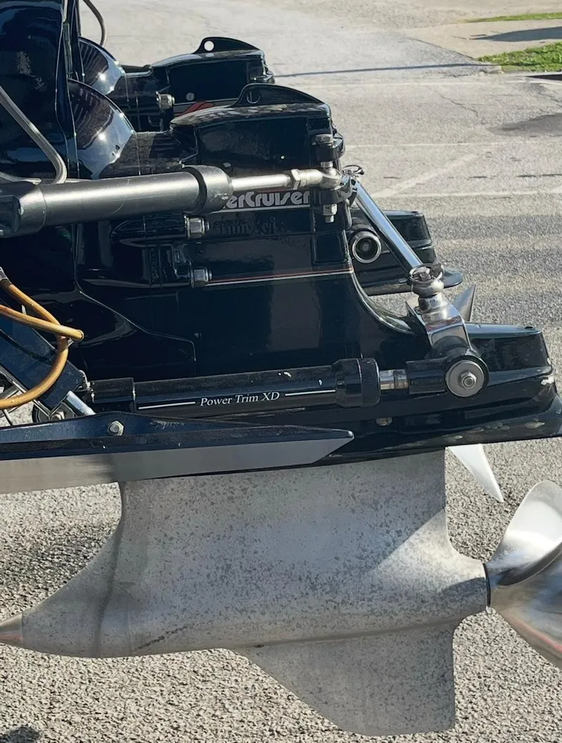 Slide: The Image of 1987 Cigarette 38 Top Gun boat engine detail with propeller and mechanical components. - 5