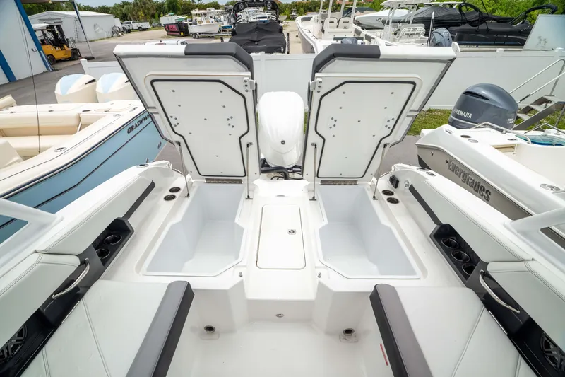 Slide: The Image of 2023 Cobalt R6 Outboard boat interior with open storage compartments, showcasing sleek design and functionality. - 10