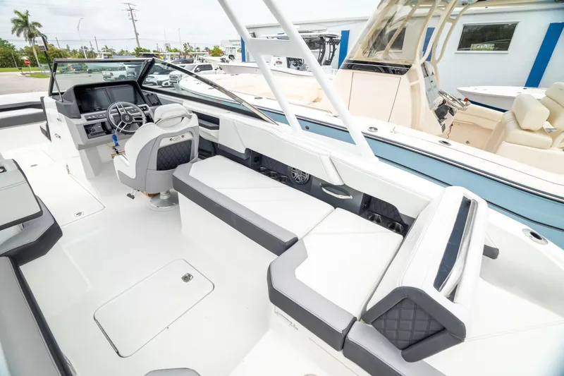 Slide: The Image of 2023 Cobalt R6 Outboard boat interior with sleek seating and modern dashboard. - 22