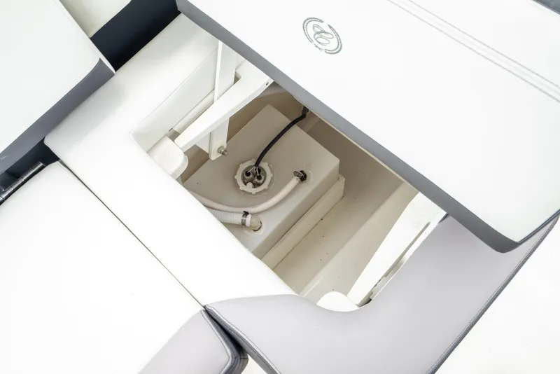 Slide: The Image of 2023 Cobalt R6 Outboard storage compartment with sleek white interior design. - 28