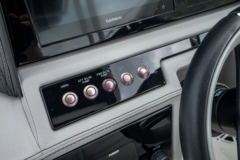 Slide: The Image of Dashboard controls of 2023 Cobalt R6 Outboard boat with Garmin display. - 37