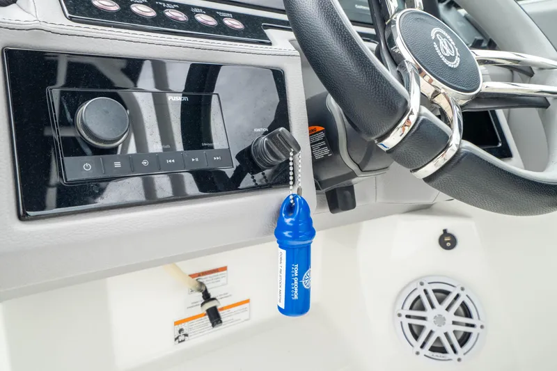 Slide: The Image of 2023 Cobalt R6 Outboard dashboard with steering wheel and audio controls. - 39