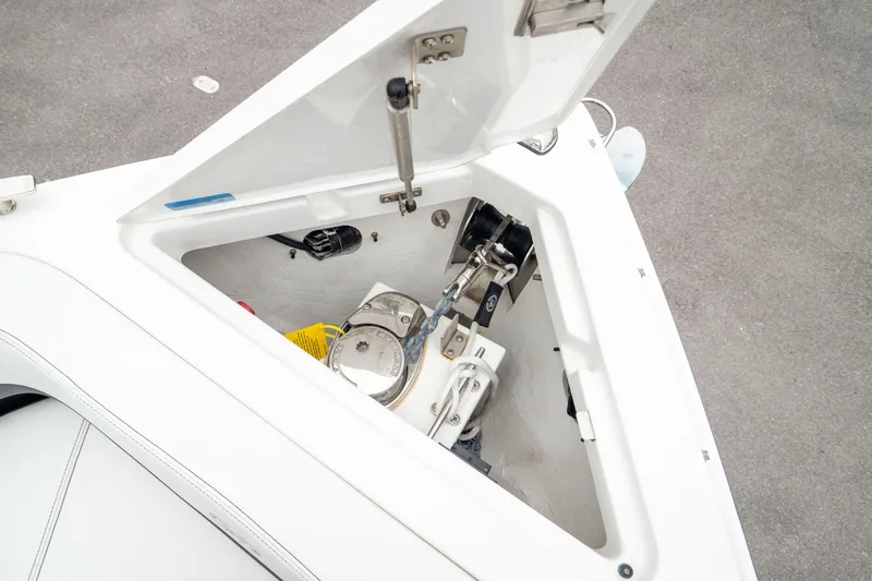 Slide: The Image of 2023 Cobalt R6 Outboard anchor locker with open hatch, showcasing storage and equipment. - 44