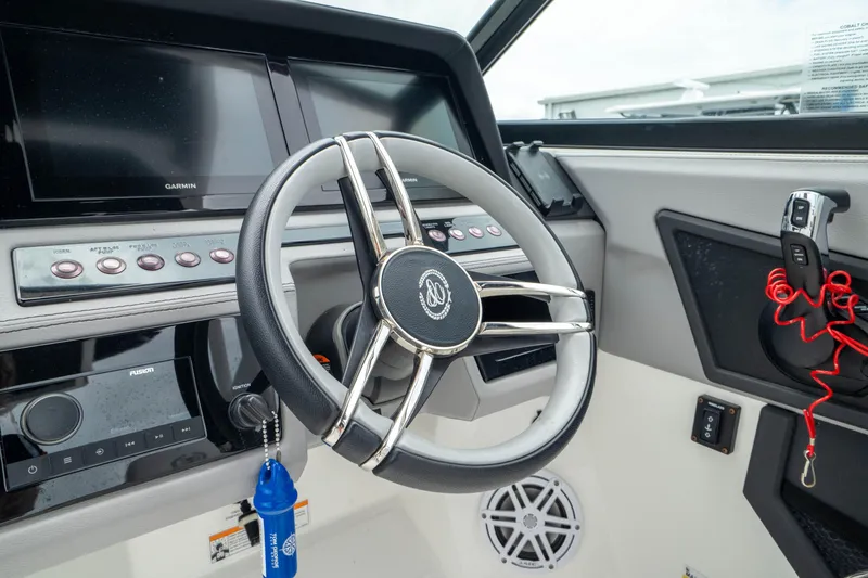 Slide: The Image of 2023 Cobalt R6 Outboard steering wheel and dashboard with modern controls and displays. - 8