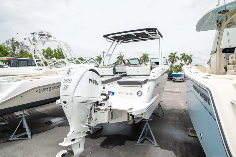 Slide: The Image of 2023 Cobalt R6 Outboard boat with Yamaha engine, displayed outdoors on stands. - 9